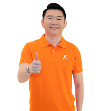 Ascendra team member in an orange polo giving a thumbs up.